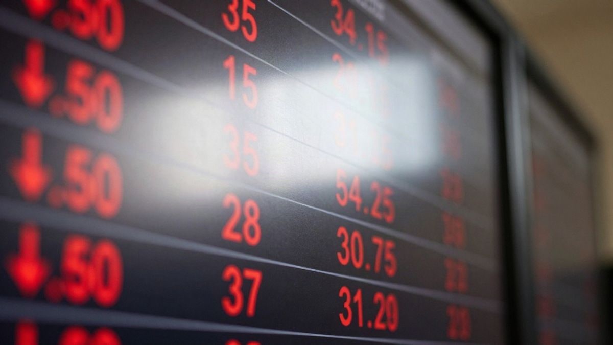 Illustrative image: stock market quotes screen with red arrows in the foreground