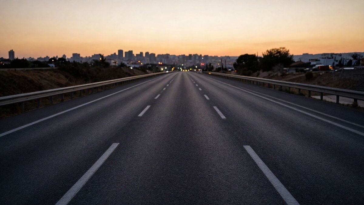 Illustrative image: wide-angle view of a road with converging lines at sunset