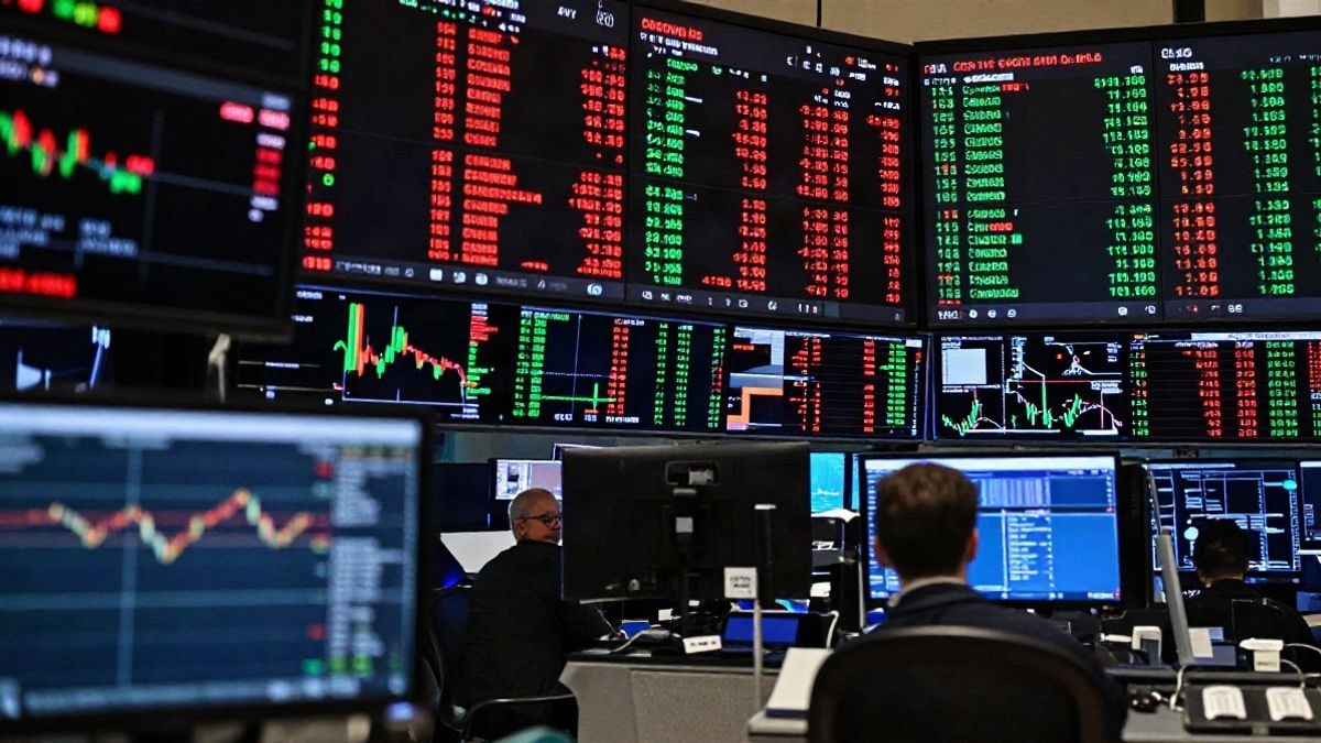 Illustrative image: stock market quotation screens in a market room illuminated with artificial light