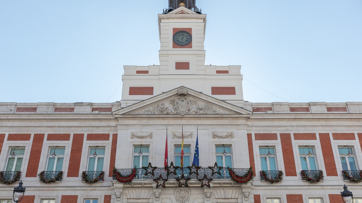Facade of the Royal Post Office with tower and clock at Puerta del Sol